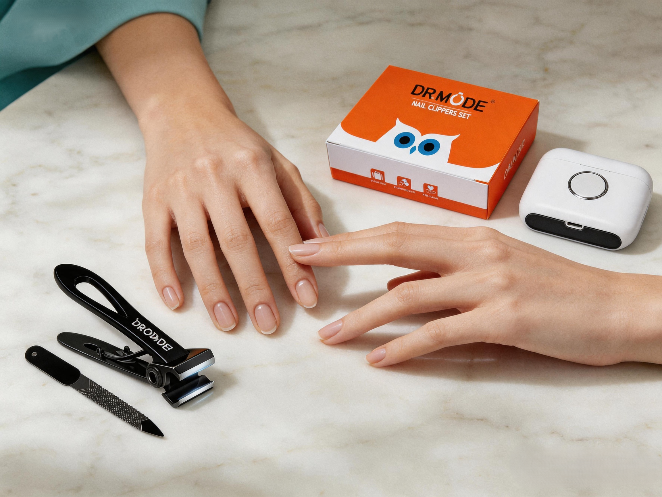 DRMODE electric vs traditional nail clippers set on marble table, elegant at-home nail care scene