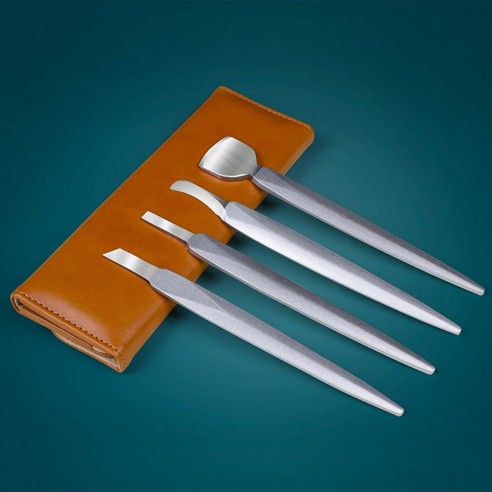 Set of stainless steel manicure tools with brown case on blue background
