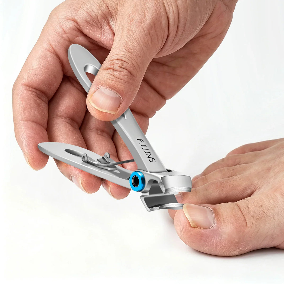 Close-up of a professional German nail clipper delivering a clean cut on toenail, showcasing the precision engineered sharp cutting edge