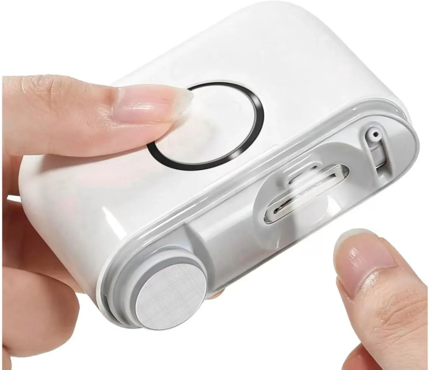 Electric nail clipper for manicure, white, held in hands, close-up view